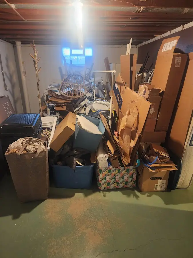 Roll-off dumpster container at job site for 2 Yard Dumpster Rental in Cave Springs